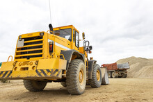 Wheel Loader, Industrial Machinery On Ore Quarry Site, Heavy Duty Excavator Moving Gravel And Rocks
