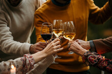 Group Of Friends Clinking Glasses In A Toast, Celebrating The Simple Joys Of Life.