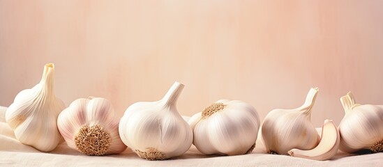 Aufkleber - Scattered garlic cloves on a black table Key in various global dishes A nutritious item isolated pastel background Copy space