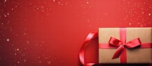 Top Down Image Of Gift Box In Cardboard Packaging With Red Ribbon On Isolated Pastel Background Copy Space With Space For Text In The Background