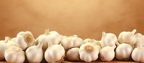 Aufkleber - Scattered garlic cloves on a black table Key in various global dishes A nutritious item isolated pastel background Copy space