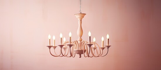 Poster - Wood chandelier illuminated against isolated pastel background Copy space