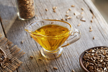 Poster - Milk thistle oil and seeds on a table