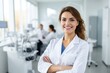 © SOLDATOOFF - Female portrait of a smiling austrian dentist in the background of a dental office.