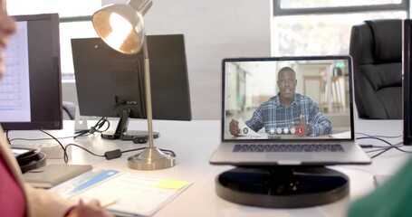 Poster - African american businessman on video call on laptop screen