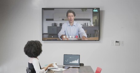 Poster - African american businesswoman on video call with caucasian male colleague on screen