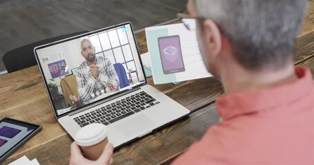 Poster - Caucasian businessman on laptop video call with african american male colleague on screen