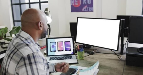 Wall Mural - African american businessman on video call with blank screen