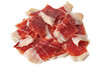 Sliced Iberian Serrano ham isolated on white background. Iberian serrano ham is a Spanish delicacy,famous for its smoky flavor and tender, salty texture, the richness of the Iberian culinary tradition