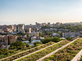 Wall Mural - flowerbeds on Cascade stairways in Yerevan city on summer sunset