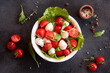 Caprese salad with mozzarella cheese and tomatoes of Italian cuisine