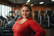 © Keitma - Beautiful chubby girl at the gym , overweight young woman doing exercises