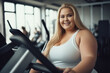 © Keitma - Beautiful chubby girl at the gym , overweight young woman doing exercises