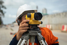 Professional Female Engineer Surveyor Takes Measures With Theodolite At Road Construction Site.