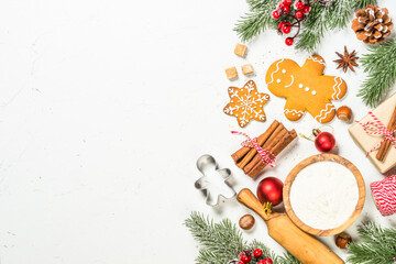 Canvas Print - Christmas baking background on white table. Christmas gingerbread and spices with holiday decorations. Top view with copy space.