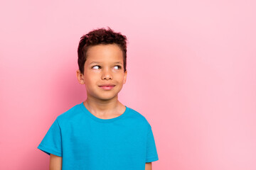 Wall Mural - Photo portrait of pretty schoolboy look interested empty space dressed stylish blue outfit isolated on pink color background