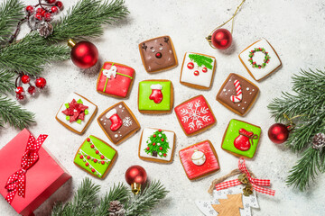 Wall Mural - Christmas gingerbread cookies with holidays decorations. Creative handmade present for christmas holidays. Top view image.