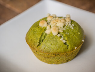 matcha green tea muffin on a white dish