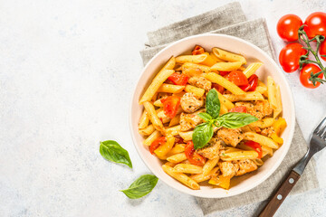 Sticker - Pasta with chicken and vegetables. Traditional italian food. Top view at white table.