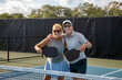 © pics721 - Two Pickleball Players Posing at the Net