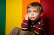 Studio portrait of a little boy being interested and interogative, isolated on colorful background. Kids emotions or moods concept. Generative AI