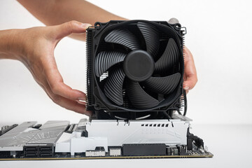 Poster - Installing a large air cooler on a computer processor.