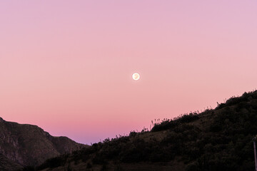 Wall Mural - Pink sky with a beautiful supermoon in a sunrise