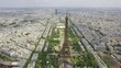 Aerial view of the Eiffel Tower and Champ de Mars in Paris, France.Overview of the surrounding city. Cinematic 4k.