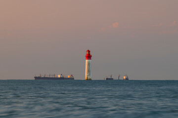 Wall Mural - Phare de Chauvea near Ile de Re with ships to La Rochelle, Pays de la Loire, France