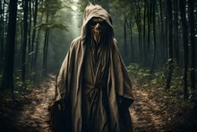 A Terrible Scarecrow With A Canvas Bag On His Head And In A Sackcloth Robe Sneaks Through The Dense Forest. Evil Forest Sorcerer. Halloween Tales. Horror, 