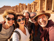 © Nathan Hutchcraft - A Photo of Older Friends Laughing and Taking a Group Selfie in Front of a Historical Monument