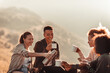 © Marko Geber - Young and diverse group of female friends taking a coffee break and resting while out hiking in the mountains