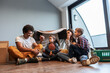 © BalanceFormCreative - Family lying down in front of the improvised tent in the living room. Moving house concept.