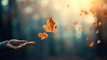 Autumn Mental Health. Embracing Change: Person Releasing Autumn Falling Leaf Into The Wind, Signifying Letting Go And Embracing Transitions