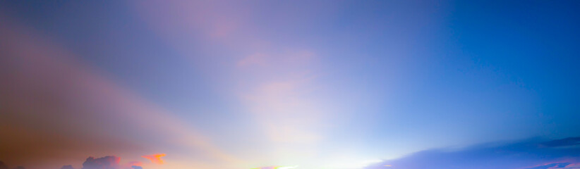 Wall Mural - blue soft panorama sunset sky background with light pink clouds
