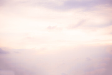 Wall Mural - gray blurry sky background with light pink clouds