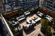 A townhouse's rooftop terrace, offering panoramic views of the surrounding cityscape 