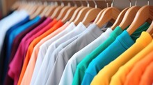 Colorful T-shirts On Hangers, Apparel Cloth Background.