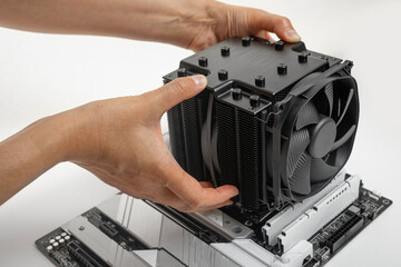 Poster - Installing a large air cooler on a computer processor.