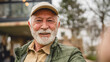 © Miljan Živković - One senior man stand outdoor in front of his house happy confident