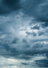 Wall Mural - The dark sky with heavy clouds converging and a violent storm before the rain.