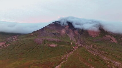 Wall Mural - Clouds Moving Over The Mountain Peak In Borgafjordur Eystri, East Iceland. - aerial