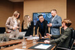 © Vladislav - Successful entrepreneur specializing in charting during a meeting with a multinational employee. Mature businessman is discussing work at the conference table in the office.