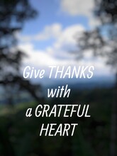Motivational Quote "Give Thanks With A Grateful Heart" On Nature Background. Beautiful Blue Gradient Of Nature.