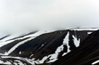 mountain landscape with snow and clouds in longyearbyen 