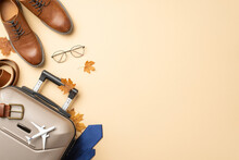International Business Voyage In Autumn Season. Top View Image Of Miniature Plane Model, Belt, Shoes, Travel Bag, Glasses, Maple Leaves On Beige Surface With Available Space For Text Or Advertising