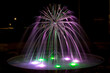 Podświetlona fontanna nocą. Płynąca woda. Wojkowice.