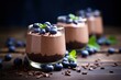 Chocolate mousse with fresh blueberries in a glass on wooden background, Chocolate mousse with fresh blueberries in glass jars, selective focus, AI Generated