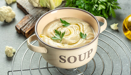 Wall Mural - Cauliflower cream soup, Healthy vegan bowl with puree soup puree. Food recipe background. Close up