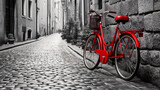 Fototapeta Do pokoju - Retro vintage red bike on cobblestone street